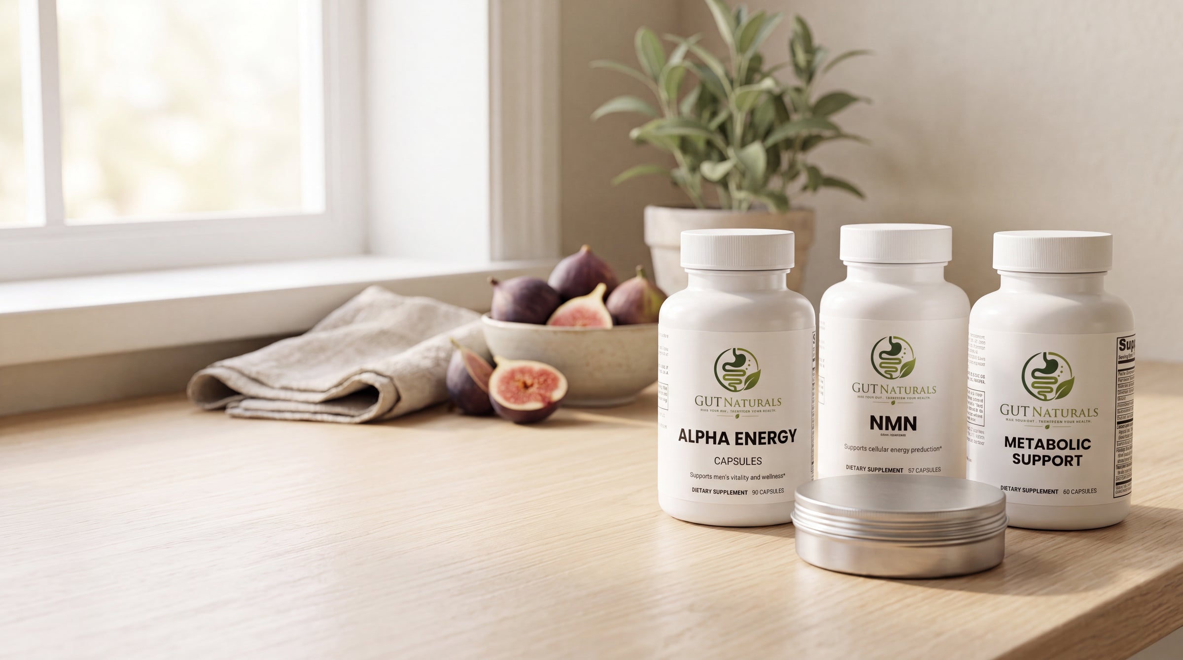 GutNaturals Alpha Energy, NMN and Metabolic Support bottles on a sunlit oak kitchen counter