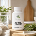 GutNaturals Ox Bile Complex bottle on a sunlit oak kitchen counter with sage, rosemary and a glass of water