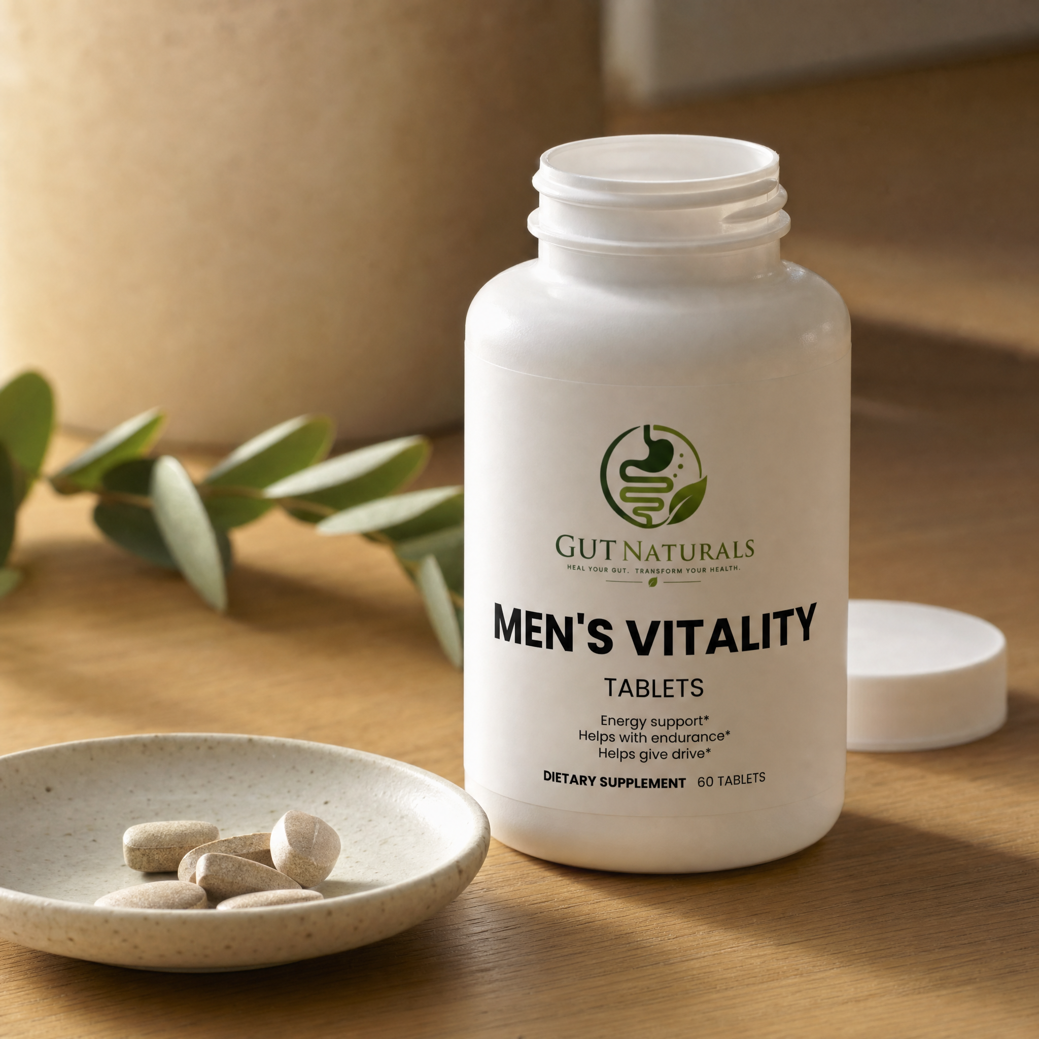 GutNaturals Men's Vitality bottle open with tablets in a ceramic dish on a sunlit oak counter