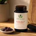 GutNaturals Reishi Relax Gummies jar open with blackberry gummies in a ceramic dish